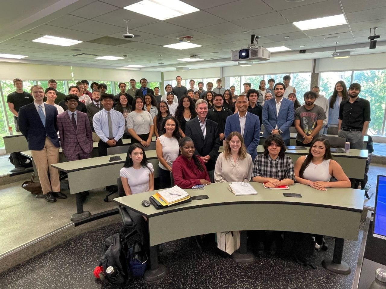 Grant Hauskins with classmates and visiting business executives in a UIC classroom